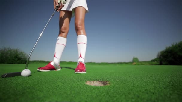 Close Female Golf Player Holes Out Putt Young Woman Red — Stock Video