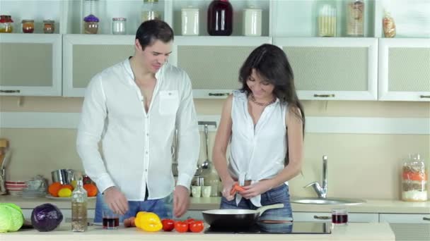 Girl Chopped Carrots Guy Gives Her Tomato Young Smiling Friends — Stock Video
