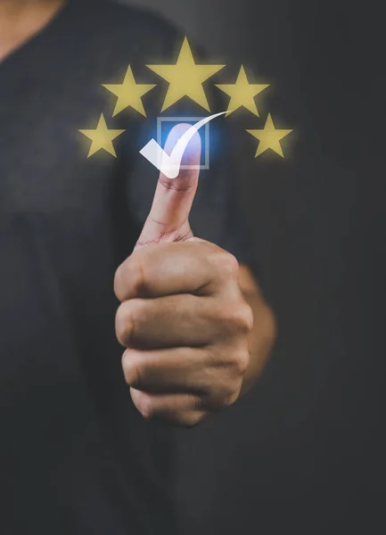 Human hand raise thumbs up with five stars and check mark