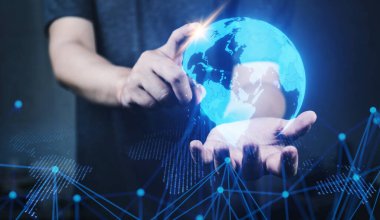 İnsan tutuşu ve Dünya 'nın ışıldayan hologramı. bilgi ve teknoloji kavramı