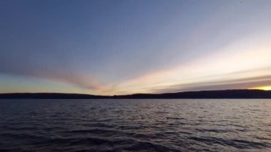 Sunset on Lake Constance panoramic view with colorful clouds in the sky