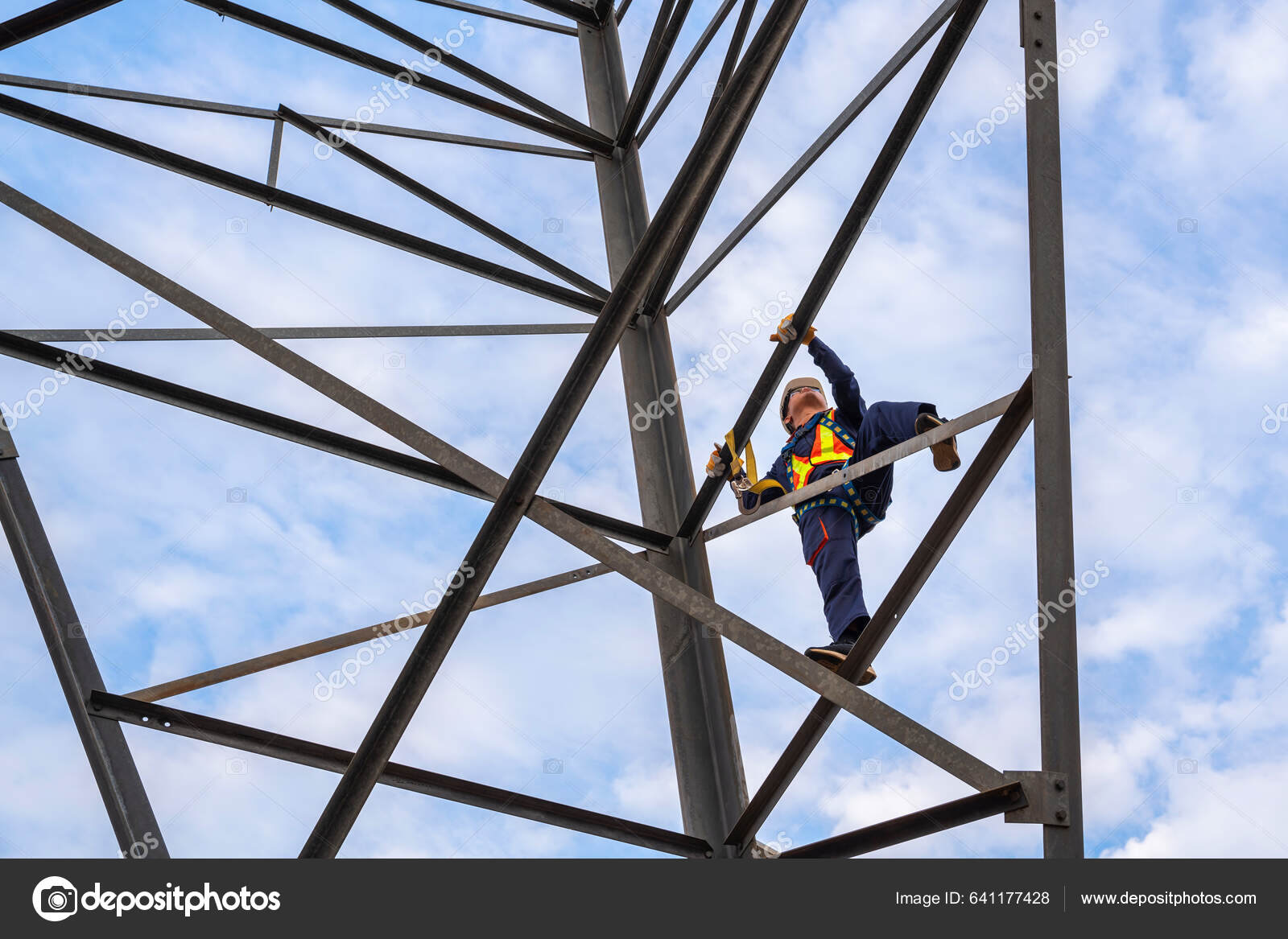 Close Workers Wearing Safety Harnesses Working High Voltage Pylons