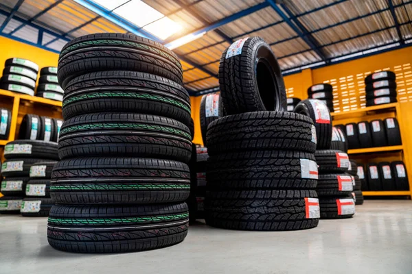 New tires, Car tires at warehouse. Automobile industry.