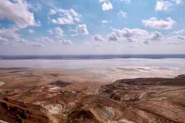 On the Ustyurt Plateau. Here, the Ustyurt Cliff steeply breaks by a cascade of clay-limestone and chalk steps, at the bottom of which lies a vast salt marsh, called in this region, Tuzbair.  clipart