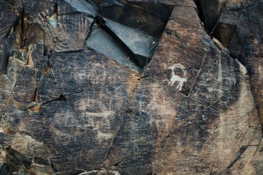 Tamgaly 'deki petroglifler. Tamgaly, Kazakistan 'ın Almaty bölgesinde bir petroglyph alanı. Tamgaly 2004 yılında UNESCO 'nun Dünya Mirası listesine girdi. Tamgaly Almaty 'nin 170 km kuzeybatısında yer almaktadır..