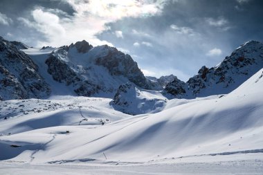 Landscape in Trans-Ili Alatau on a winter day.Trans-Ili Alatau, is a part of the Northern Tian Shan mountain system in Kazakhstan and Kyrgyzstan. clipart