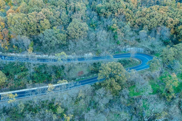 Aerial drone view autumn landscape curved road of 