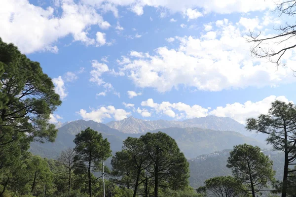 stock image clouds over the mountain