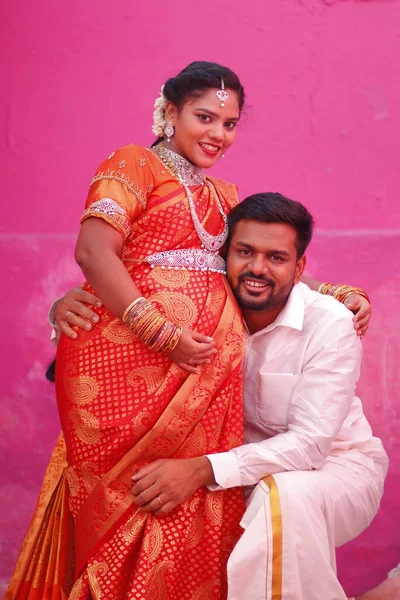 South Indian Tamil couple in traditional clothing in baby shadow function