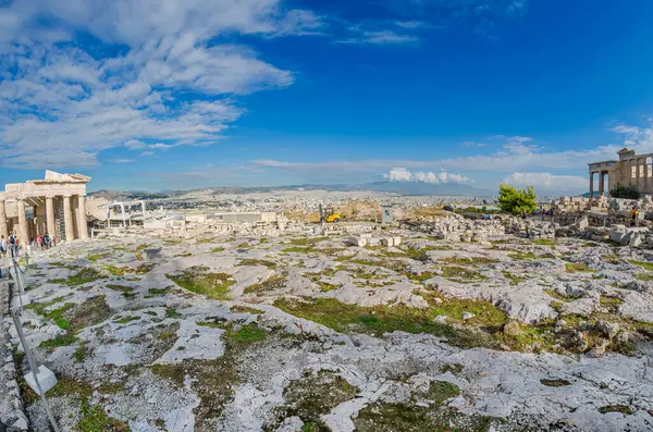 stock image Acropolis of Athens. View of Propylaia, Base of the Statue of Athena and Promachos with city of Athens in the background.