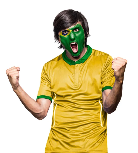 身穿球衣的足球迷 脸上涂着巴西队的旗帜 激动地尖叫着 背景是白色的 — 图库照片