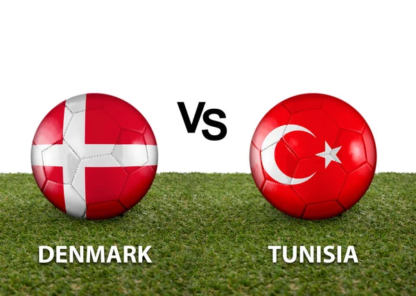 Two balls with the flags of rival countries Denmark vs Tunisia on the grass of a Qatar 2022 world cup soccer field on a white background.