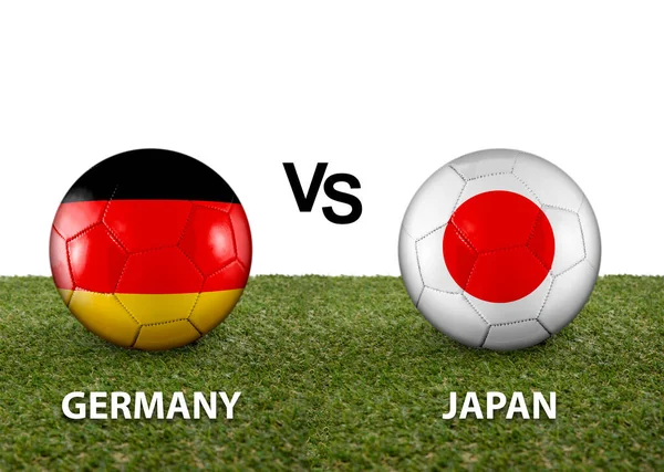 Two balls with the flags of rival countries Germany vs Japan on the grass of a Qatar 2022 world cup soccer field on a white background.