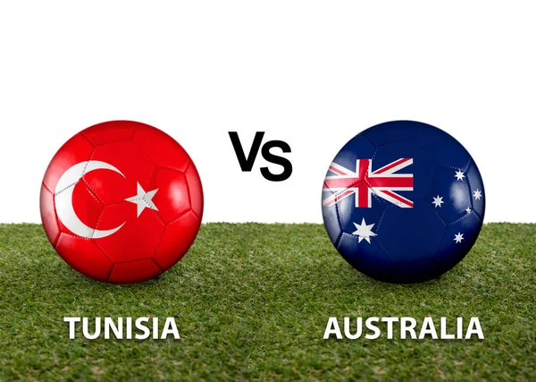 Two balls with the flags of rival countries Tunisia vs Australia on the grass of a Qatar 2022 world cup soccer field on a white background.
