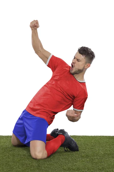 一名职业足球运动员 身穿红色的哥斯达黎加国家队球衣 为进球而激动地大喊 他的进球在白人背景下表现出挑战和快乐的表情 — 图库照片