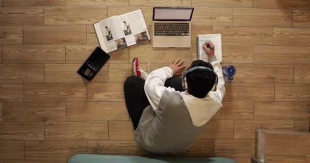 Young Man Headphones Sitting Floor His House Studying Working Home — 비디오