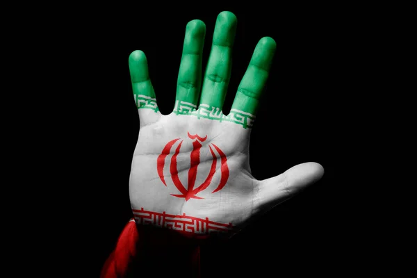 Rude man hand with flag of Iran in stop sign to anger, discrimination, racism, abuse on black background.