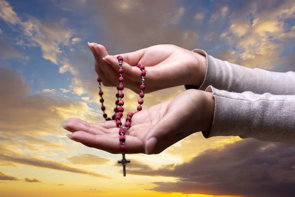 Woman Hands Prayer Sign Rosary Sky Background Clouds Sunset — Zdjęcie stockowe