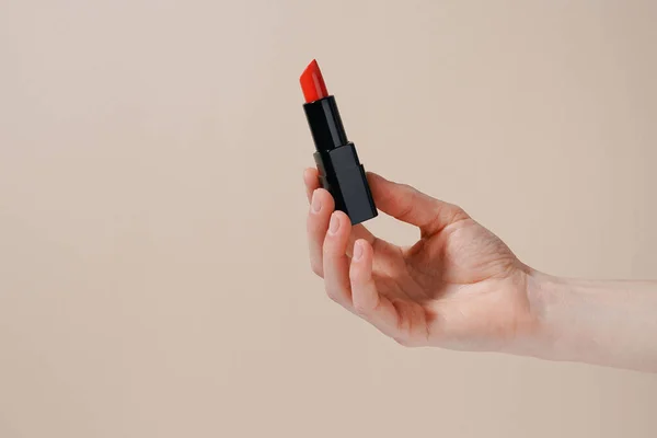 Female Hand Holding Red Lipstick Beige Isolated Background Decorative Cosmetics — Stock Photo, Image