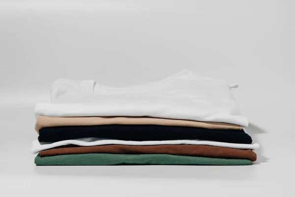 Shirts Folded Neat Stack White Isolated Background Concept Changing Wardrobe — Stock Photo, Image