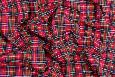 Geleneksel İskoç tartan renklerinde buruşuk, buruşuk kumaş dokusu. Model veya tasarımın için arkaplan