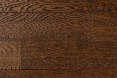 Doğal kahverengi meşe parke dokusu yakından. Parlatılmış kaplama için tahta tahtalar. Ahşap örnekleme arka planı