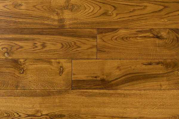 Texture of natural mustard oak parquet. Wooden boards for polished laminate. Hardwood background