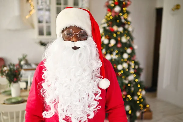 African American Man Santa Costume Smiles Background Christmas Decor Fir — Stock Photo, Image