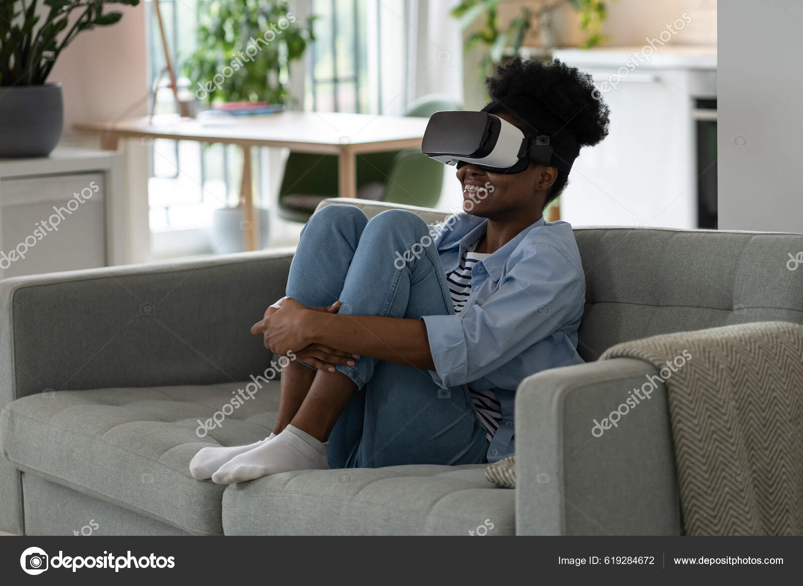 Young Joyful African Woman Wearing Modern Headset Sitting Sofa Living —  Stock Photo © Dimaberlin #619284672