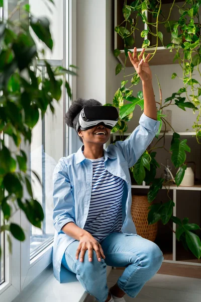 Cheerful Black Woman Glasses Testing New Video Game Sits Windowsill — Stock Photo, Image
