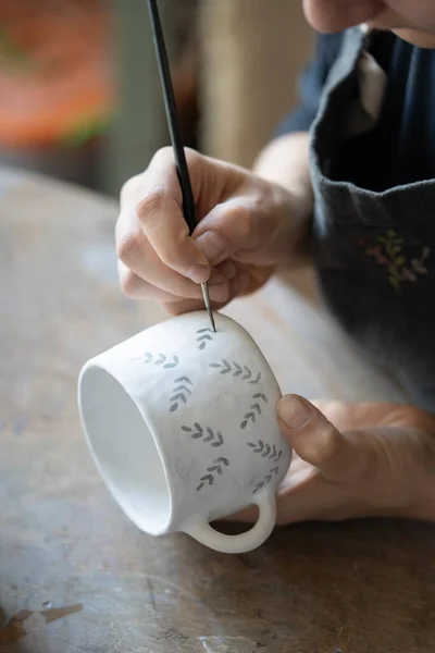 Hands Professional Artisan Hold White Ceramic Mug Drawing Pattern Dark — Photo