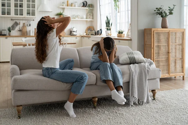 Stubborn teenage daughter wont listen mother, covering ears. Upset depressed mom parent of difficult teen girl feeling sad and frustrated after family fight. Tensions in parent-child relationship