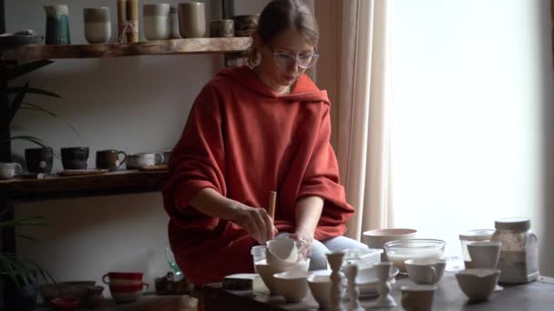 Creative Focused Female Artist Painting Porcelain Utensils Large Brush Introverted — Vídeos de Stock