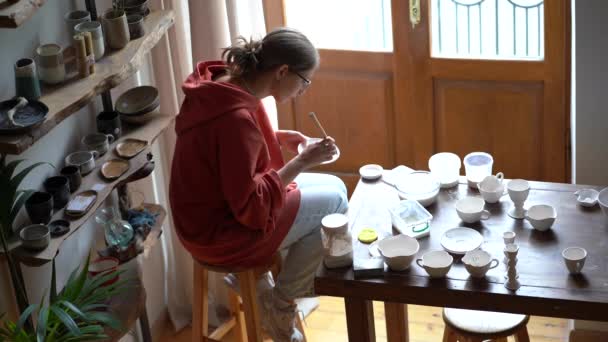 Creative Girl Artist Sits Home Pottery Workshop Diligently Applies Authors — Video Stock