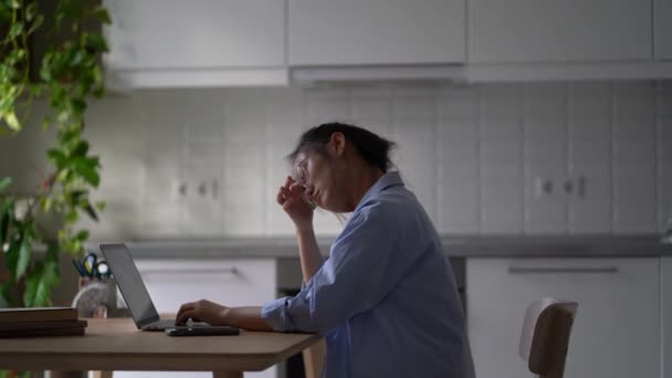 Exhausted Busy Young Asian Woman Sits Kitchen Finishes Typing Laptop — Video