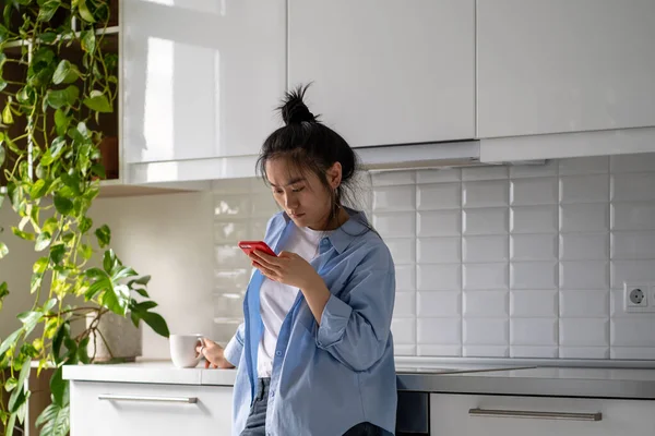 Frowning Annoyed Asian Young Woman Holds Smartphone Get Message Email — Stock Photo, Image