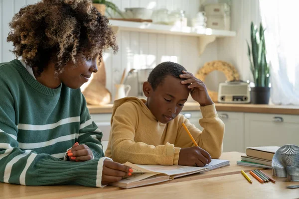 Homeschooling Together Caring African American Mother Helping Thoughtful Adopted Son — Stock Photo, Image
