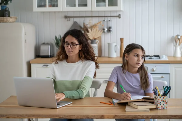 Teen Girl Child Doing Homework Studying While Her Mother Sitting — Stock Photo, Image