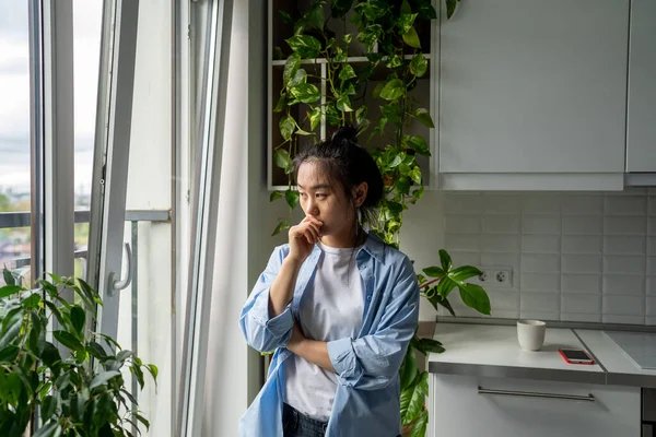 Pensive Millennial Asian Girl Looking Out Window Thinking Life Problems — Stock Photo, Image