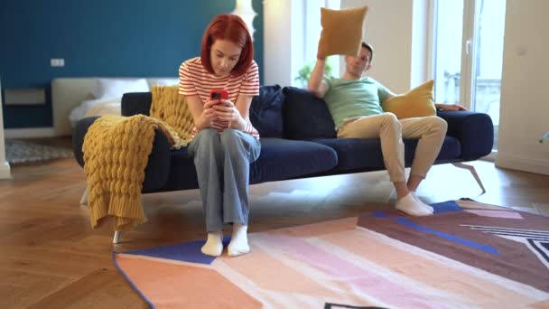 Playful Fool European Husband Throw Sofa Cushion Offended Woman Mobile — Stock Video