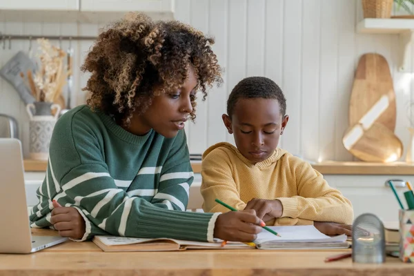 Focused Biracial Mother Explaining Difficult School Task Attentive Son Effective — Stock Photo, Image