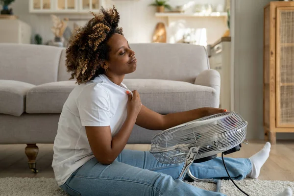 Overheating Homes Happy Young African American Woman Sits Front Electric — Stockfoto