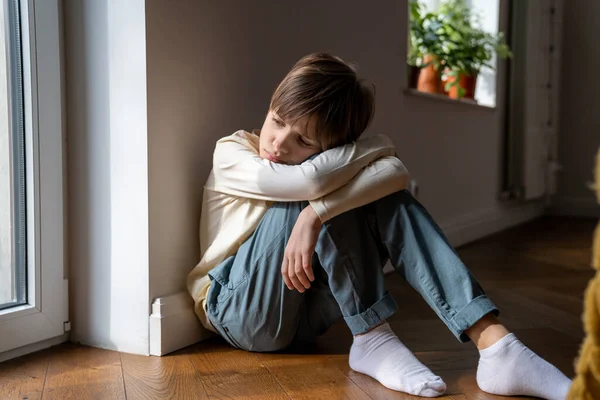 Upset Boy Adopted Child Sitting Alone Floor Home Feeling Sad — Stock Photo, Image