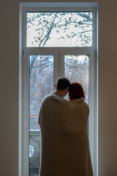 Rear View Couple Wrapped Blanket Looking Out Window Cuddling Dreaming — Stock Photo, Image
