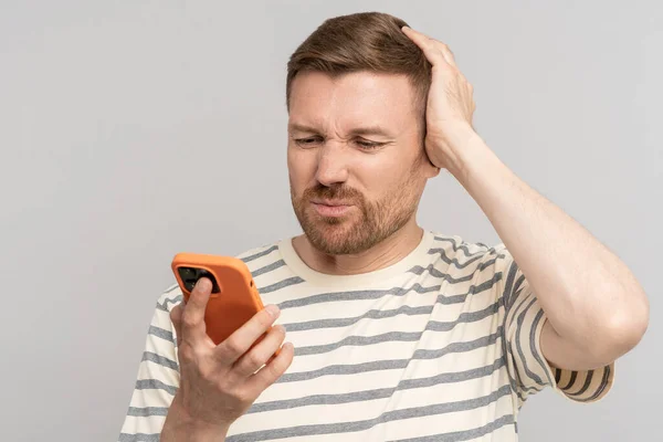 Awkward Man Looking Phone Screen Embarrassing Difficult Clumsy Uncomfortable Message — Stock Photo, Image