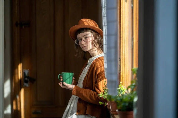 Pensive Teenager Girl Standing Window Holding Cup Tea Dumdering Feeling — Stock fotografie