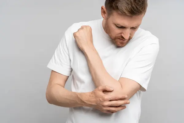 Man Touching Hand Elbow Feeling Pain Isolated Gray Background Injury — Stock Photo, Image