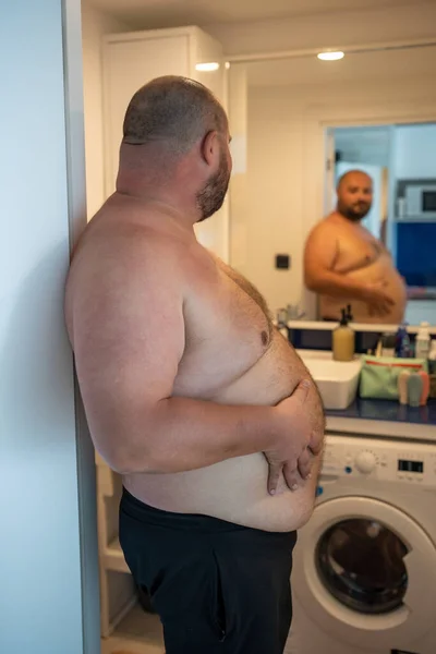 Overweight Smiling Man Naked Torso Suffering Extra Weight Looking Mirror — Stock Photo, Image