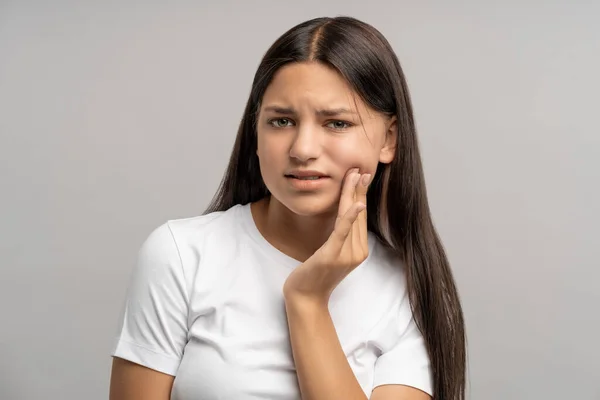 Unhappy Teenage Girl Touching Cheek Hand Painful Face Expression Caused — Stock Photo, Image