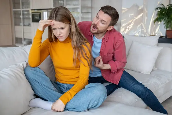 Abusive Husband Screaming Wife Sitting Couch Home Tears Streaming Face — Stock Photo, Image